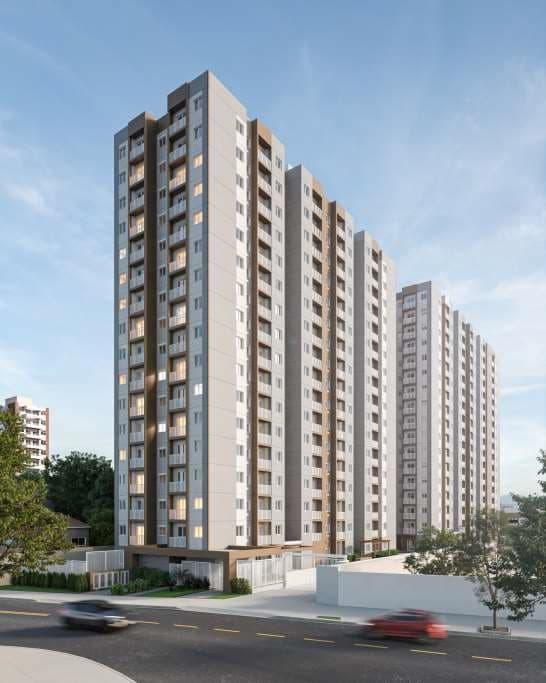 Vista externa dos edifícios residenciais altos com varandas e rua em primeiro plano.