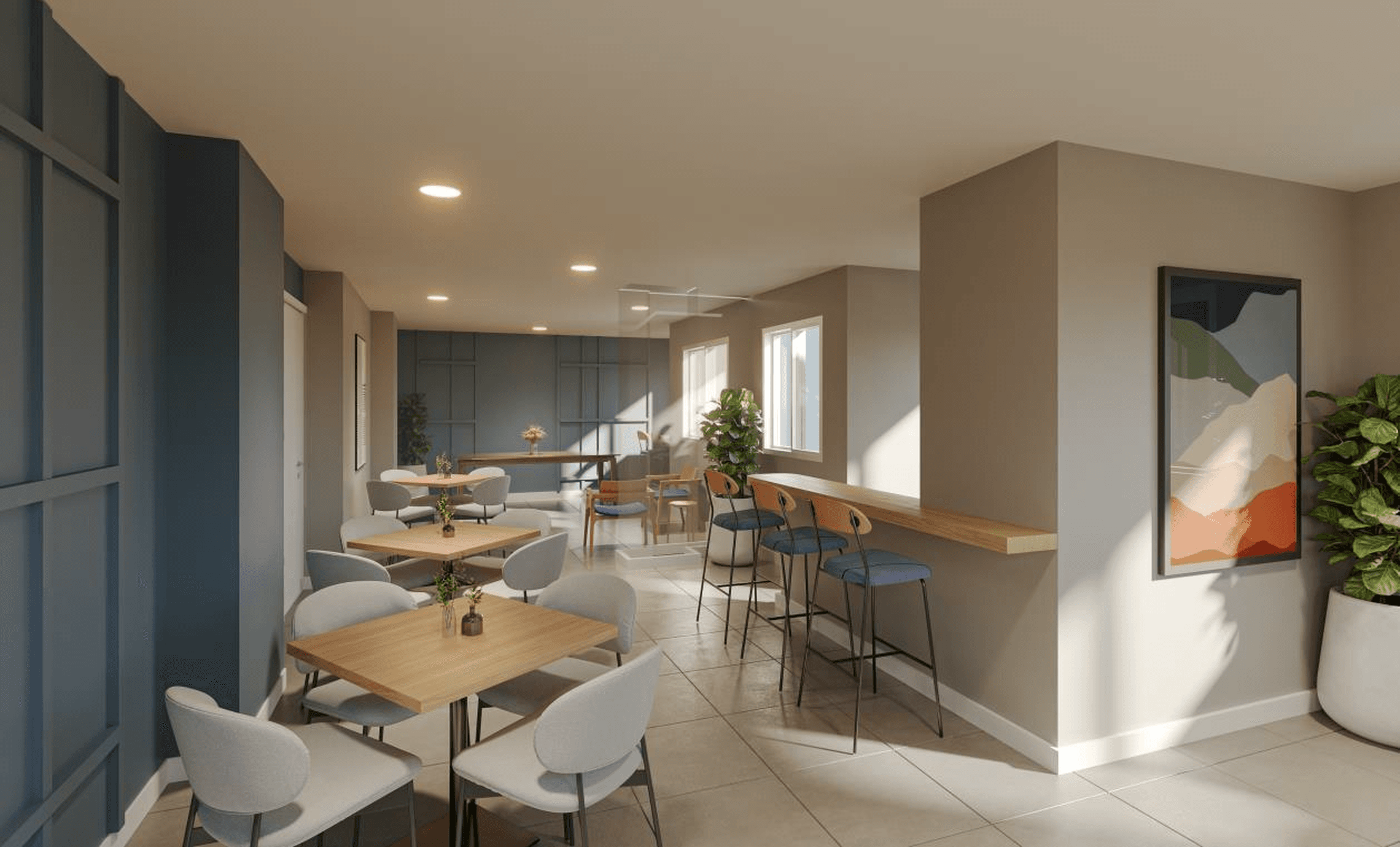 Espaço de convivência interno com mesas de jantar, cadeiras e balcão com banquetas.