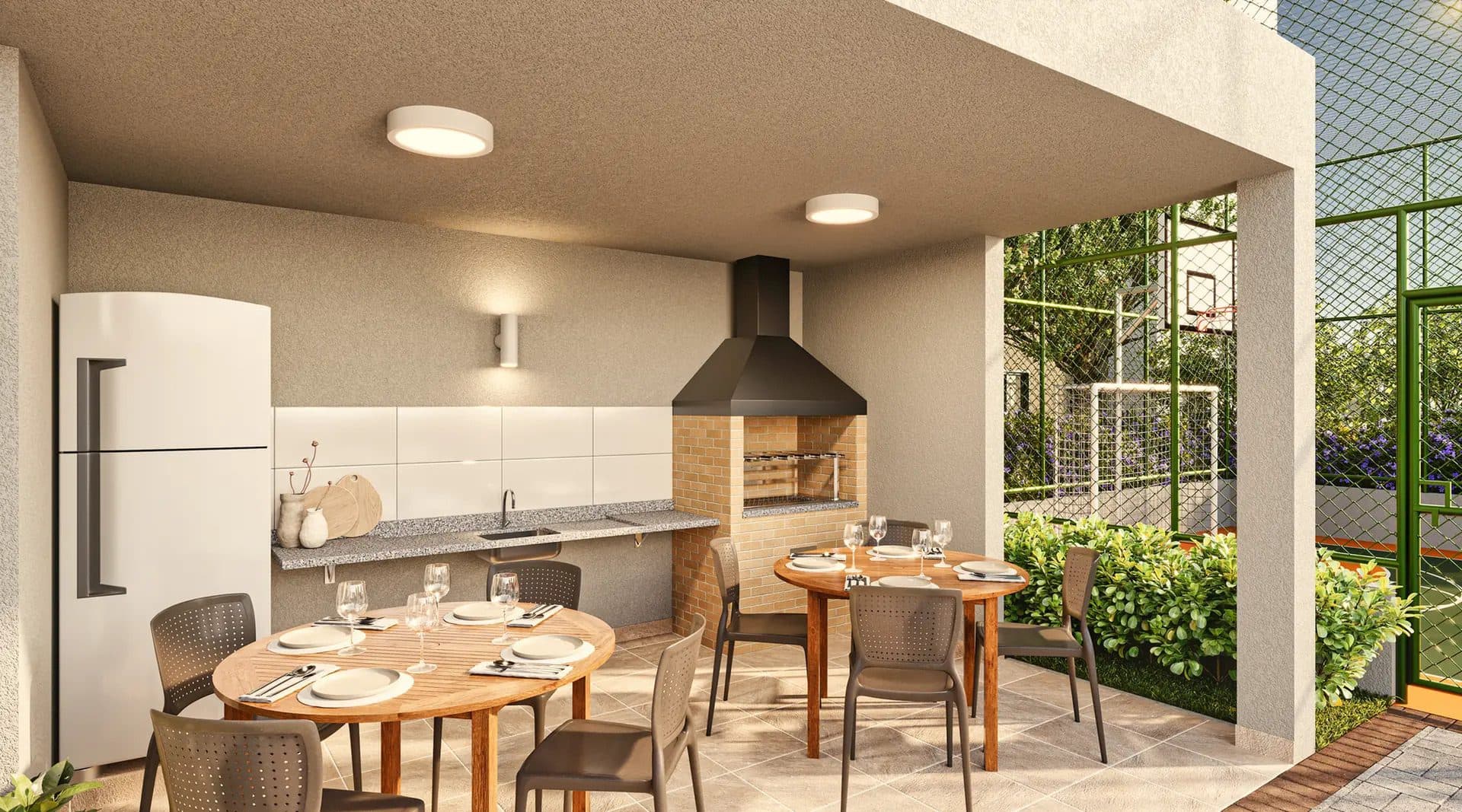 Área gourmet externa coberta com churrasqueira de tijolinhos, geladeira, bancada em granito e mesas de jantar.